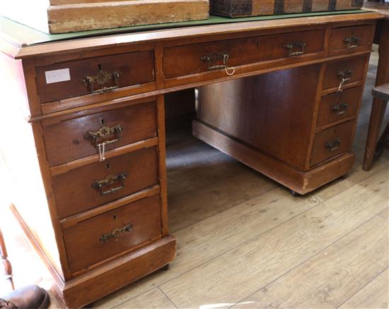 A late Victorian golden oak pedestal desk, W.135cm H.74cm D.74cm